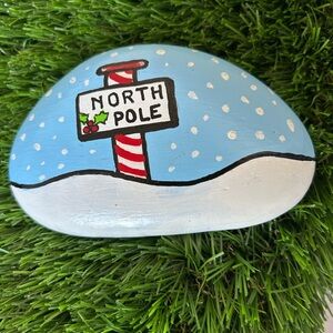 Festive Painted Stone with North Pole Design